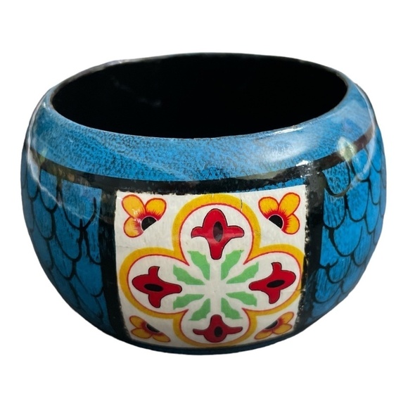 Wooden hand painted bangle. Colors of blue, red, yellow, green, and white. - Picture 1 of 8